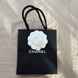 Chanel Black Bag with White Floral Detail